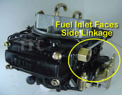 Picture of Y41 four barrel Holley Model 4160 marine carburetor with fuel inlet facing the side throttle linkage